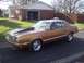 1977 Ford Mustang II - This 1977 Ford Mustang II coupe features a prominent aftermarket hood scoop and classic styling.