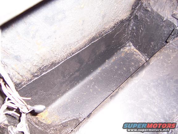 drivers side inside quarter in trunk