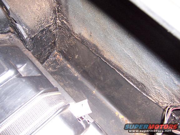 passenger side inside quarter in trunk