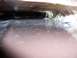 another L bracket fiberglassed onto the scoop and nut clip bolted from under the hood