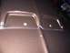 back of hood scoop mounted by 4 self-tapping screws with rubber washers