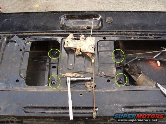 pa050077a.jpg these are 4 of the 5 bolts you have to remove to get the motor, and swing arm mechanism out.

also, this is the latch mechanism (how it would look if it were bolted underneath)