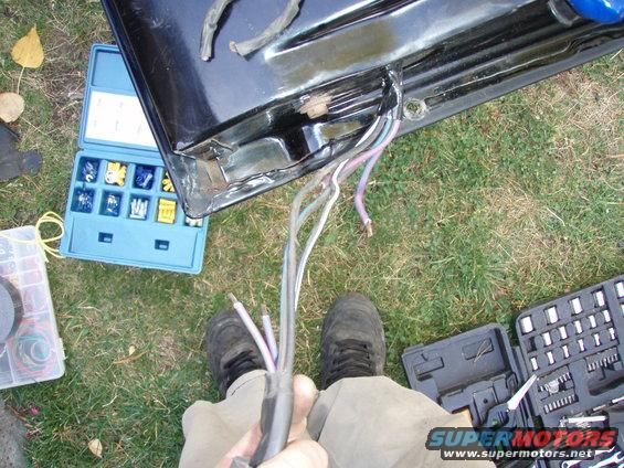 pa050079.jpg i realized that the wires were chafed on the wiring harness by the tailgate closing on them.
i cut back the wires and re-attached them with butt connectors