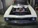 1969 Mercury Cyclone - Front view of a 1969 Mercury Cyclone with its hood open, revealing the engine compartment.