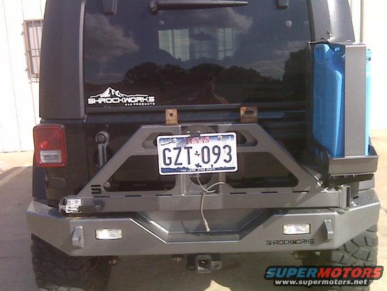 Rear of Jeep Wrangler with aftermarket bumper and spare tire carrier