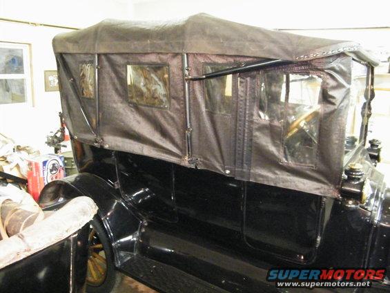 1915 Ford Model T touring car with black canvas top and side curtains