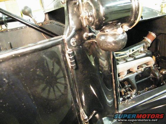 Black 1915 Ford Model T interior with visible engine and steering column