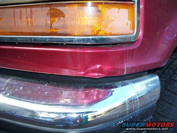 Red 1977 Ford F-150 front corner with dented bumper and dirty headlight