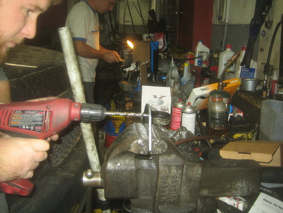 img_8421.jpg Tristan far in the back ground & David up close.
Grinding & drilling the mounting brackets.