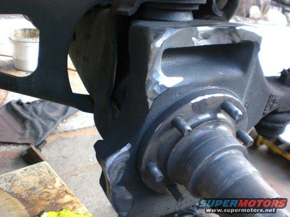cimg0415.jpg This is about how much grinding I had to do on the knuckles. Used the longer chevy spindle studs. You can only remove 5 from the chevy axle without removing the balljoints. So grab 2 from another axle or use a good grade 8 for the 6th one.