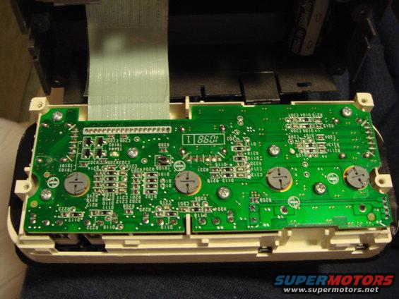 The back of the climate control unit panel.  To get here, remove the radio, then reach behind the ECC and push it out towards you; it pops right out.  Remove the four screws that hold the face on, then there are three tabs to release.