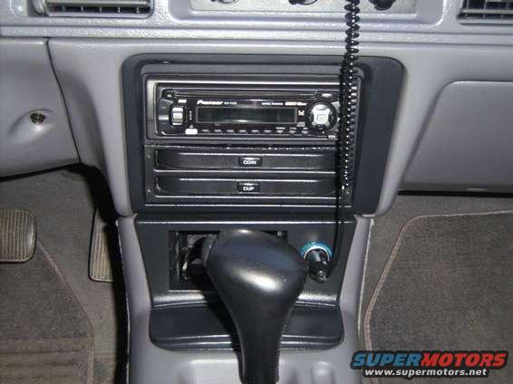 1994 Mercury Sable interior showing Pioneer stereo, coin and cup holders, and automatic shifter