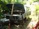 1982 Ford Bronco - This 1980s Ford Bronco is shown with its hood open and the front end partially disassembled, suggesting it is undergoing repairs or restora…