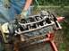 1982 Ford Bronco - An engine block is being worked on, with the crankshaft and connecting rods exposed.