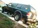 1998 Ford Ranger - Rear view of a green 1998 Ford Ranger pickup truck equipped with a camper shell.