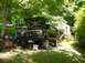 1982 Ford Bronco - 1982 Ford Bronco with hood open, parked outdoors near a trailer.