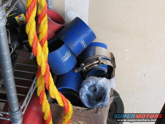 Blue silicone hoses and clamps in a box