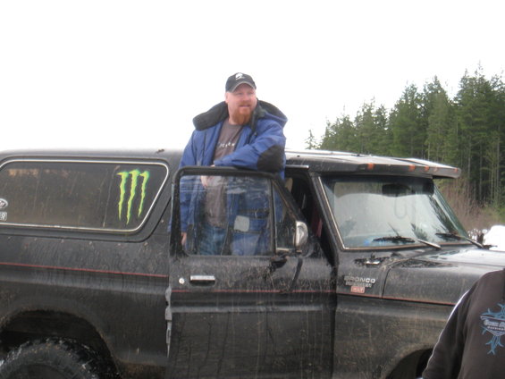 Black 1989 Ford Bronco with Monster Energy sticker on the window