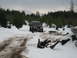 1989 Ford Bronco - A black SUV navigates a snowy, wooded area.