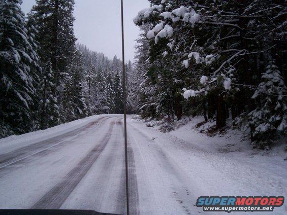 Interior view of vehicle on snowy forest road