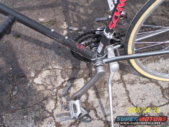 Black bicycle frame with Schwinn logo, crankset, and rear wheel