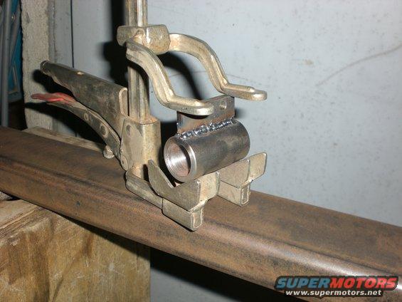 Welding bushing to bolt on tab