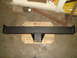 1992 Ford Bronco - A black steel trailer hitch receiver is shown mounted on wooden blocks, likely in a garage or workshop setting.