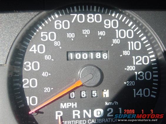Speedometer showing 100 mph and odometer reading 100186. Also shows gear selector P R N D 2 1
