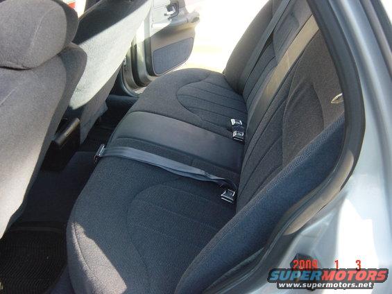 Gray fabric rear seats and seatbelts in a 2000 Ford Crown Victoria