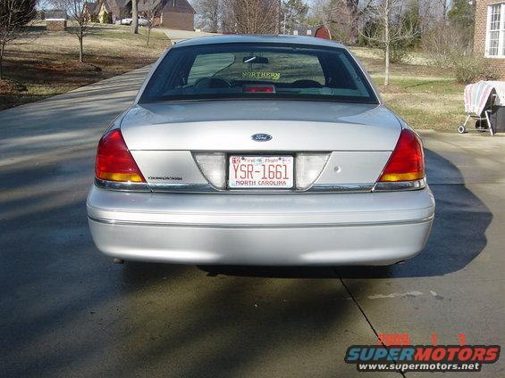 Silver 2000 Ford Crown Victoria rear view with North Carolina license plate YSR-1661