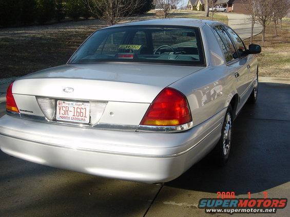 Silver 2000 Ford Crown Victoria rear view, North Carolina license plate YSR-1661