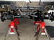 1996 Ford Bronco - Vehicle's front suspension and differential are elevated on jack stands for maintenance.
