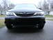 2008 Subaru Impreza - Front view of a black 2008 Subaru Impreza, showing its grille and headlights.
