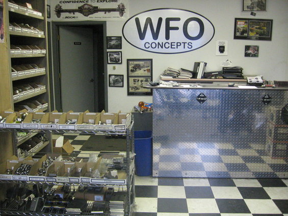WFO Concepts shop interior with parts shelves and a diamond-plate counter