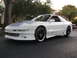 1994 Ford Probe - This 1994 Ford Probe GT features a grey hood and custom black wheels, viewed from the front three-quarter angle.