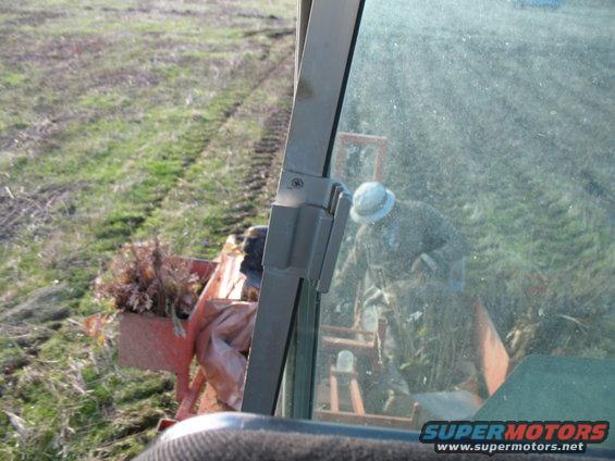 blurry, crappy pic of the planter rider puttin em in the ground