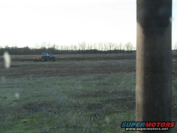 the other planter running. That weird, rusty tree looking thing is the exhaust pipe on the tractor I'm running.