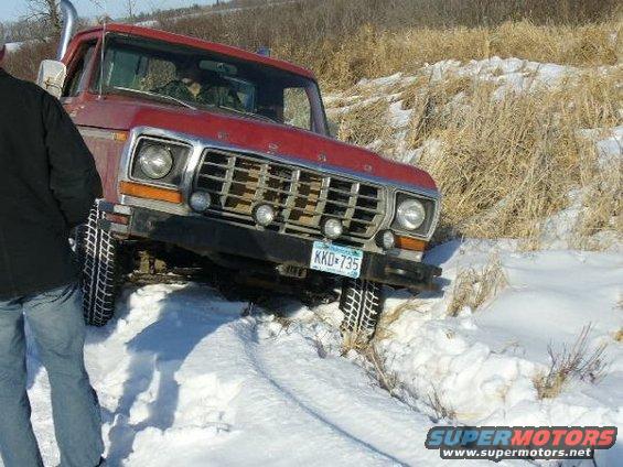 1978 Ford F-150 truck with snorkel exhaust stuck in snow, front view
