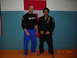 1984 Ford Bronco - Two men in martial arts uniforms pose for a photo in front of Canadian and American flags, with a date stamp of 09.01.2009.