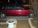 1994 Ford Crown Victoria - Side view of a red 1994 Ford Crown Victoria parked outside at night.