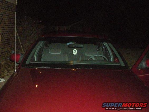 1994 Ford Crown Victoria interior and hood, front view at night
