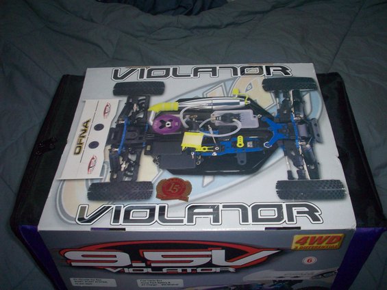 Radio-controlled car on box with 'Violator' branding and '9.5V' label