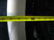 1995 Ford C-350 (Centurion Conversions) - A tape measure is used to check the clearance next to a vehicle's tire.