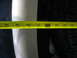 1995 Ford C-350 (Centurion Conversions) - A yellow measuring tape is positioned over a tire and a white vehicle body panel.