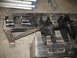 1995 Ford C-350 (Centurion Conversions) - Painted suspension parts and galvanized pipes are laid out on a workbench.