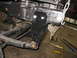 1995 Ford C-350 (Centurion Conversions) - Close-up of the modified leaf spring suspension bracket on a 1995 Ford C-350 (Centurion Conversions).