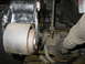 1995 Ford C-350 (Centurion Conversions) - A close-up view of a worn suspension bushing and linkage, likely from a heavy-duty truck.