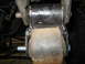 1995 Ford C-350 (Centurion Conversions) - A close-up view of a suspension component, likely a bushing, showing signs of rust and wear.
