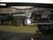 1995 Ford C-350 (Centurion Conversions) - This image shows a close-up view of a vehicle's undercarriage, focusing on a suspension component.