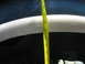 1995 Ford C-350 (Centurion Conversions) - A yellow measuring tape is used to measure the height of a vehicle's wheel well.